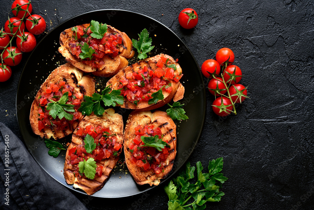 Grilled toasts with tomato salsa. Top view with copy space. Grilled toasts with tomato salsa. Top view with copy space.