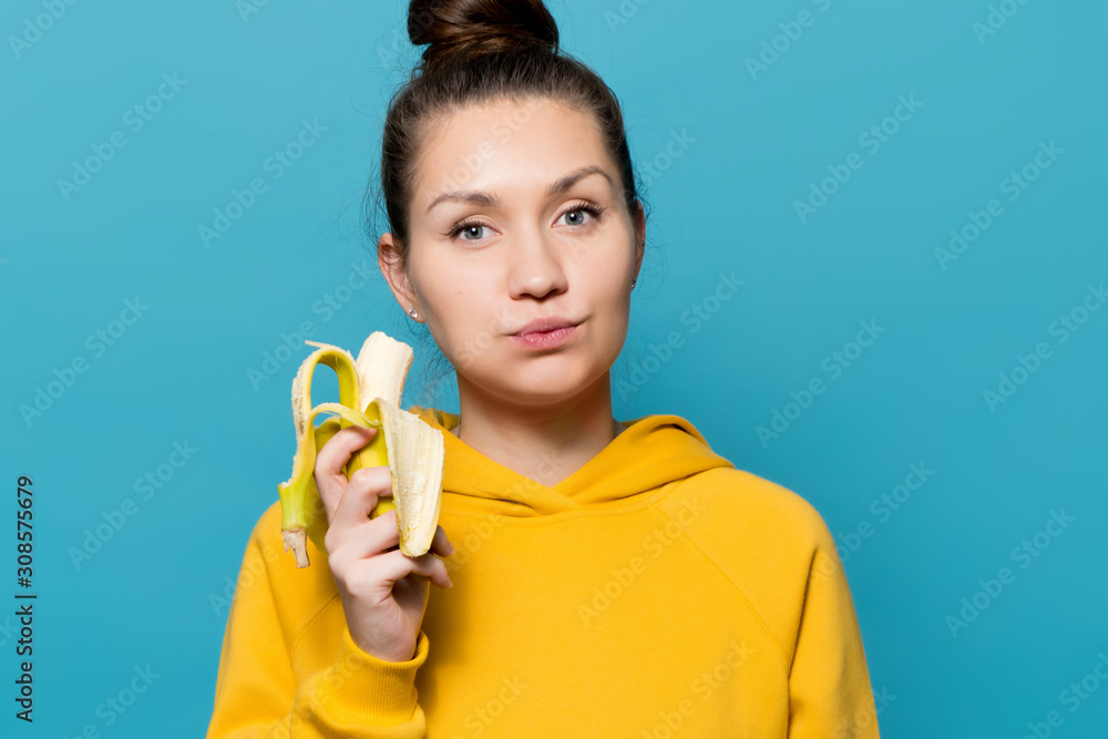 girl eats banana with pleasure, close up girl eats banana with pleasure, close up