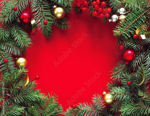 Round frame of fir branches and holiday decorations on a red background, top view with space for text. Christmas winter background, christmas card.