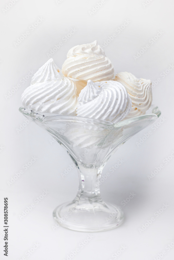 white marshmallows lies in a plate on a white background white marshmallows lies in a plate on a white background