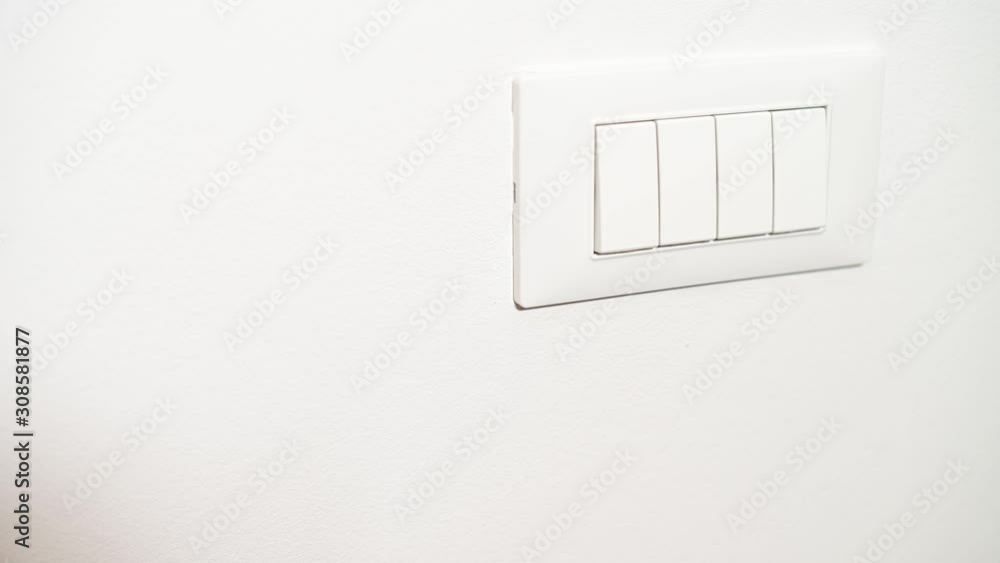 Hand turn four light switches on and off Hand turn four light switches on and off