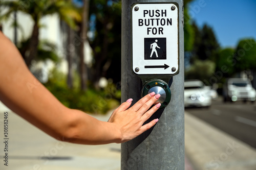 Push button at pedestrian crossing crosswalk street road photo