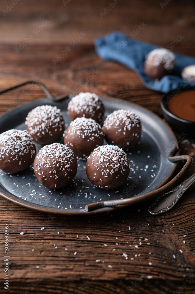 No bake delicious candy, sweet coconut balls dipped in chocolate No bake delicious candy, sweet coconut balls dipped in chocolate