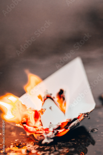 paper boat on fire