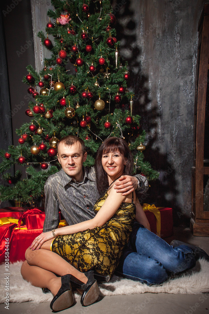 couple in love Christmas tree with gifts