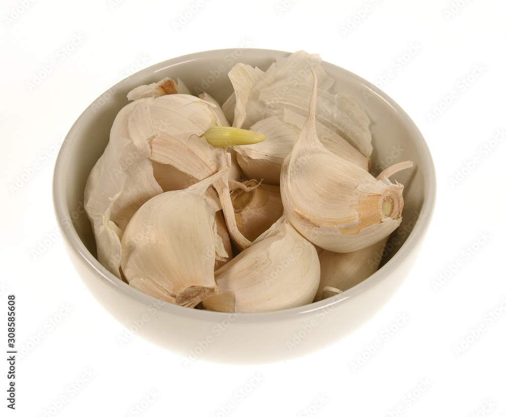 Garlic in a bowl isolated on white Garlic in a bowl isolated on white