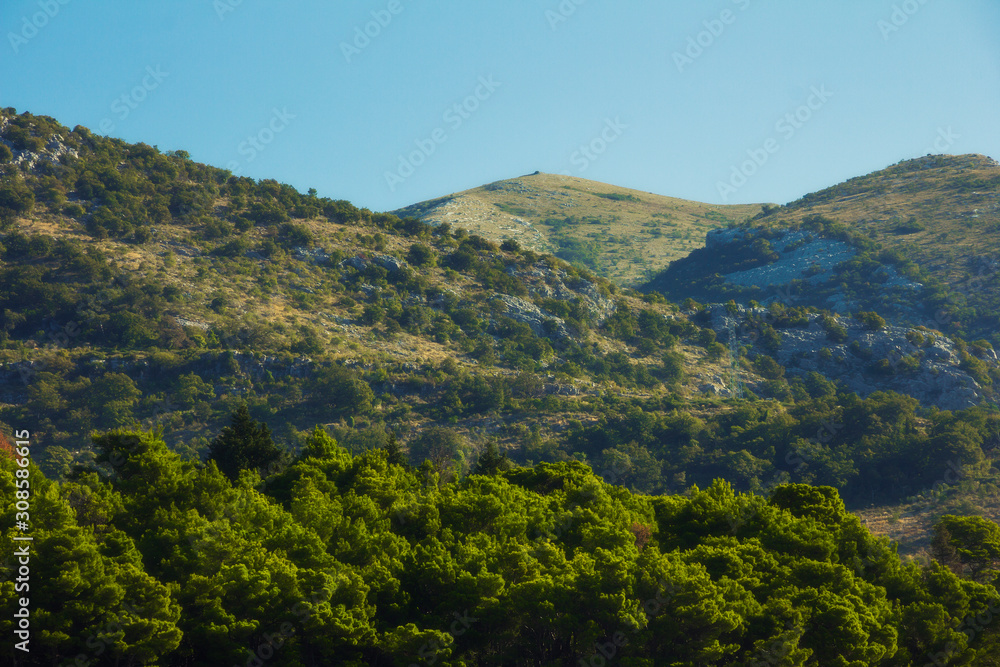 Naklejka premium Sutomore settlement near Stari Bar (Old Bar), Montenegro, the different view of suburb nature, mountains, forests 