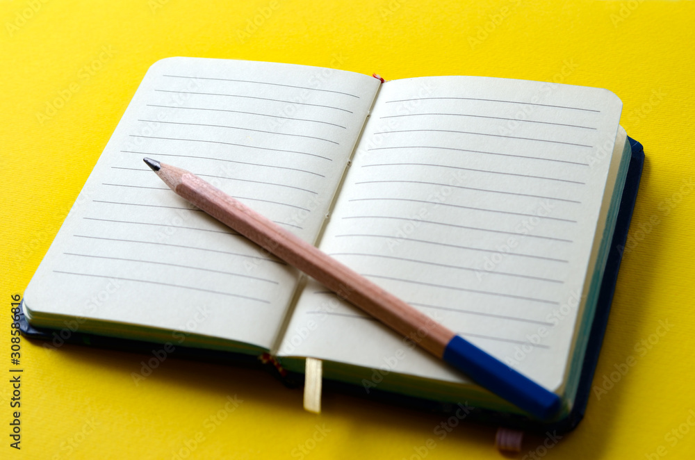 Notepad for notes is open on a blank page. Stationery, note paper. Notepad for notes is open on a blank page. Stationery, note paper.