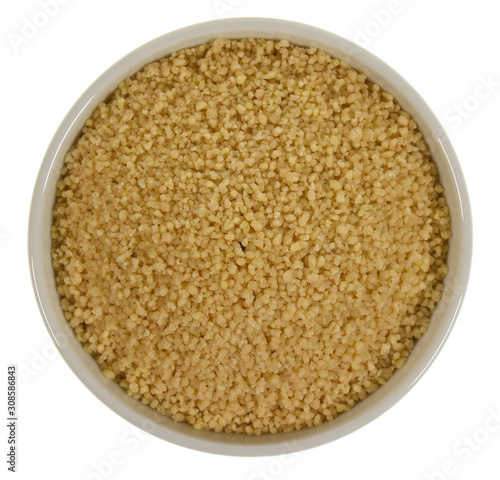 Couscous in a bowl isolated on white