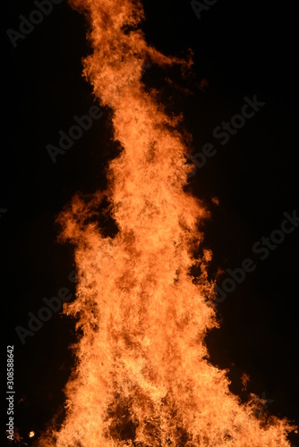Big Bonfire by Night with Orange Glowing Flames