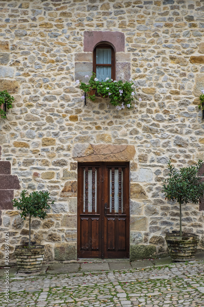 Santillana del Mar, a town in the Cantabria region of northern Spain. Detail of door and window.