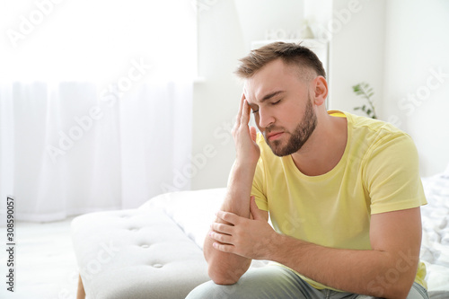 Young man suffering from he...