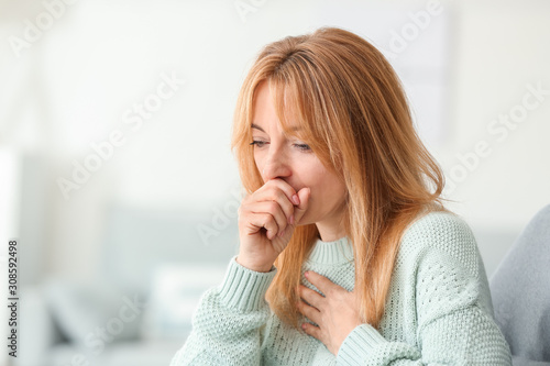 Fotografie, Obraz Beautiful mature woman ill with flu at home