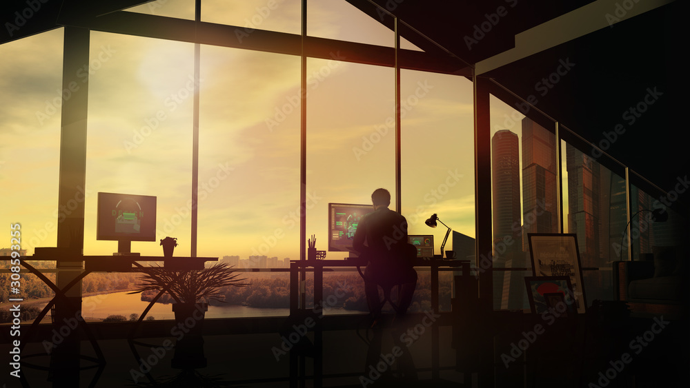 Fototapeta premium In the evening, a designer works at the table in the office.