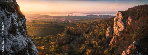 Colorful Autumn Sunset over Vineyards and Forest as Seen from Rocky Hill in Palava Protected Area near Mikulov in South Moravia, Czech Republic photo