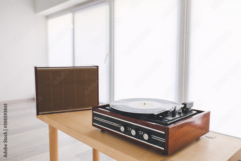Fototapeta premium Record player on table near window