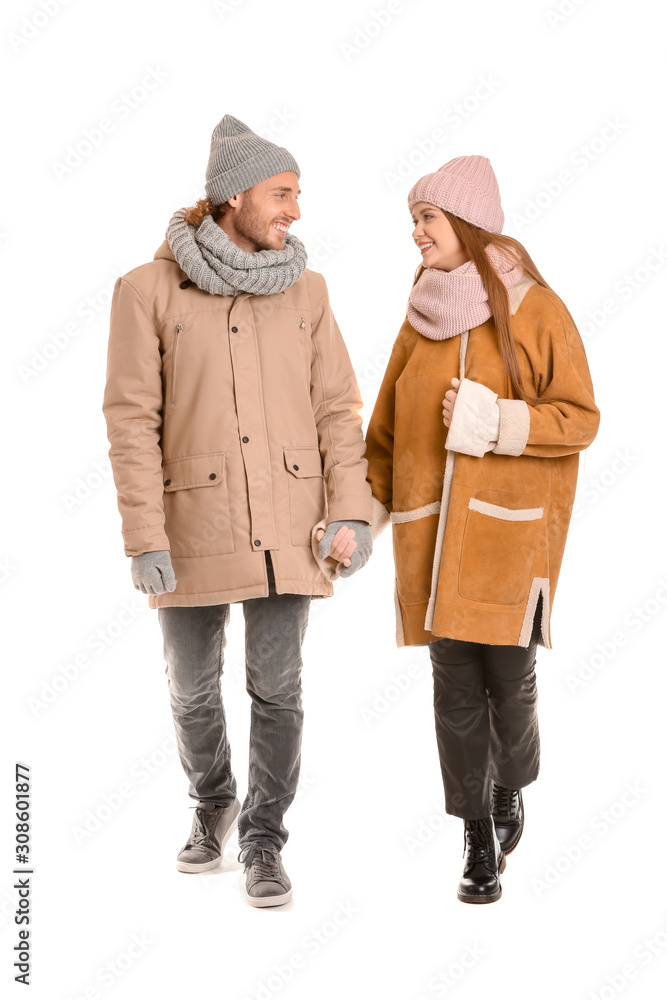 Happy couple in winter clothes on white background Happy couple in winter clothes on white background