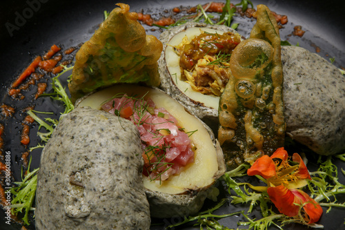 Stir fried potatoes in seaweed crust stuffed with tuna tartar. Exquisite dish. Creative restaurant meal concept.	 photo