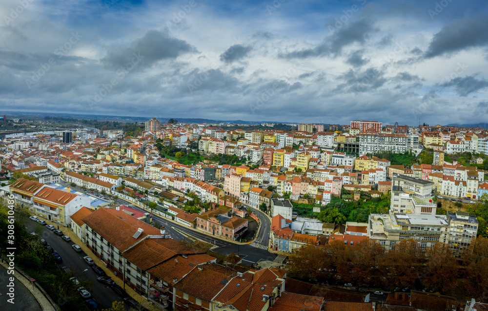 Aerial panorama of colorful houses on a hillside neighborhood in Coimbra Portugal
