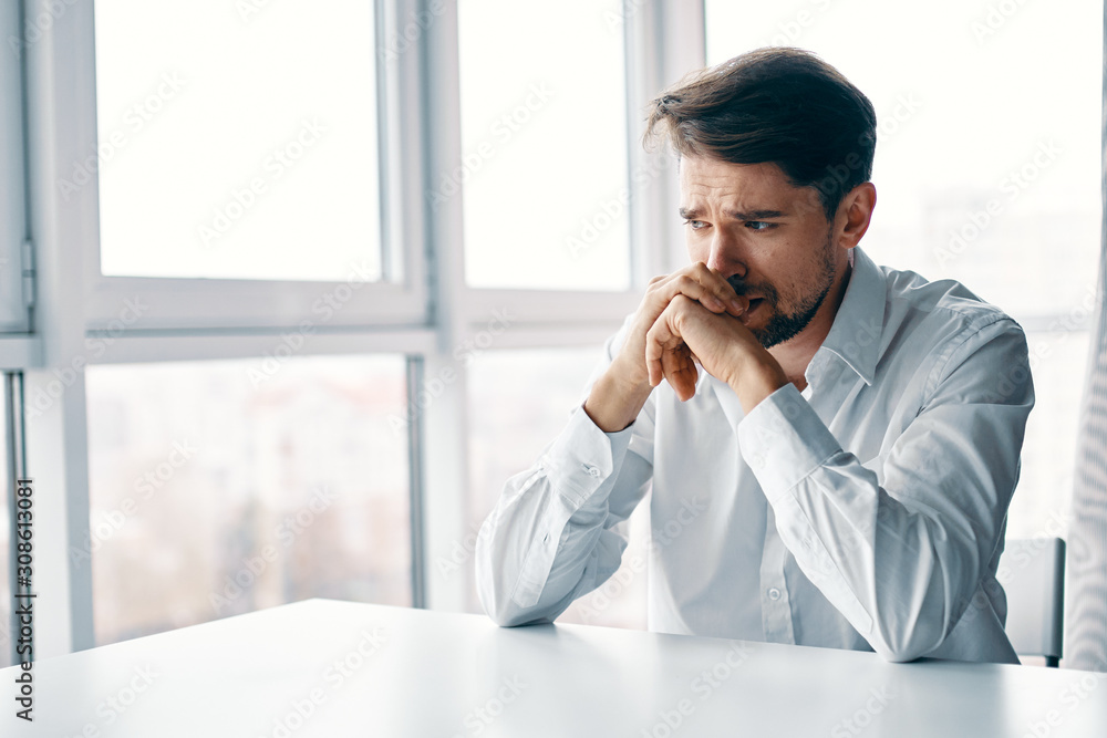 businessman talking on cell phone in office businessman talking on cell phone in office
