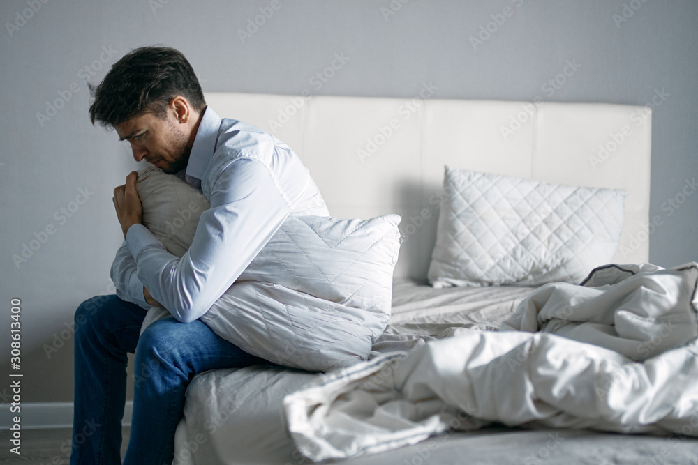 young man sitting on sofa and watching tv young man sitting on sofa and watching tv