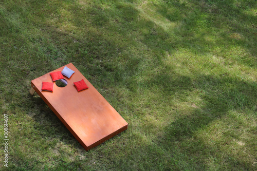 Fotografiet high angle view of Bean Bag Toss Corn Hole Game red bags and wood platform