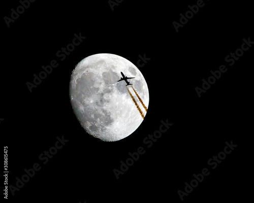 Commercial Airliner Passing in Front of the Moon