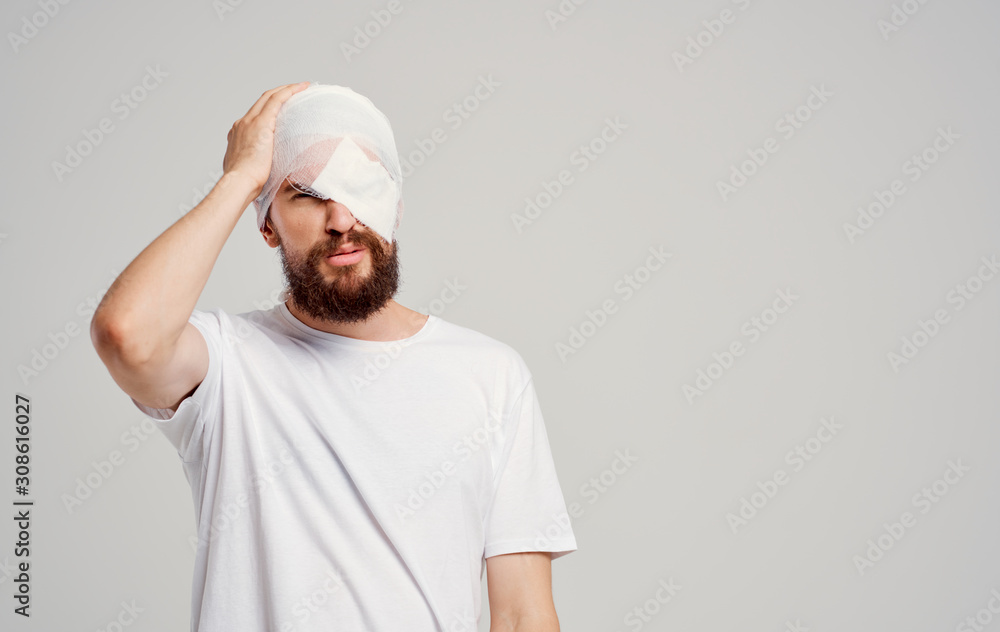 portrait of young man with hands on his head portrait of young man with hands on his head