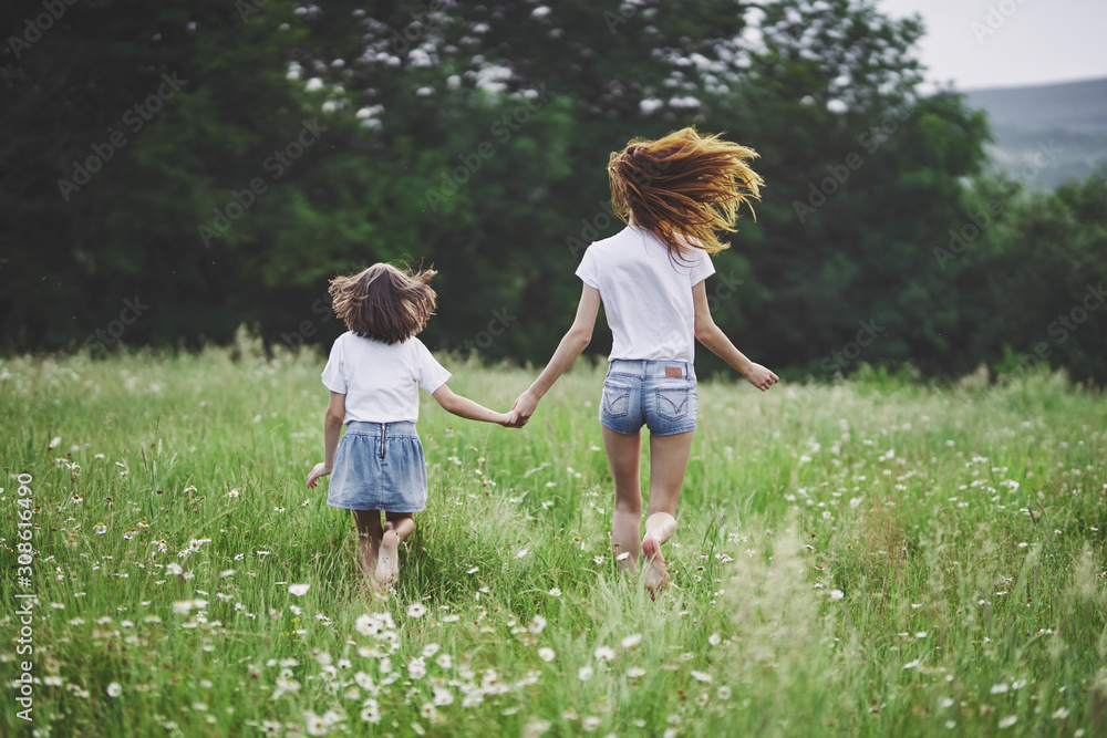 Fototapeta premium mother and daughter in the park