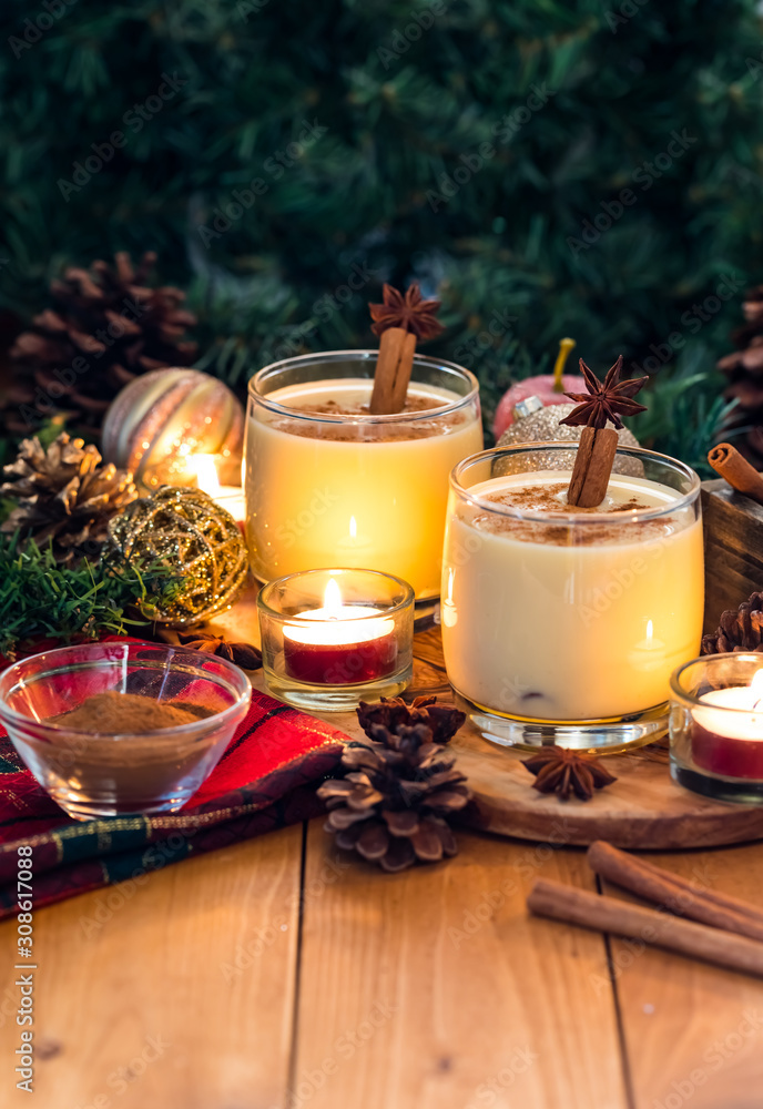 Two glasses of eggnog and cinnamon. Two glasses of eggnog and cinnamon.