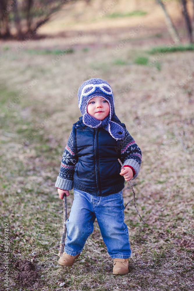 little child playing in autumn park little child playing in autumn park