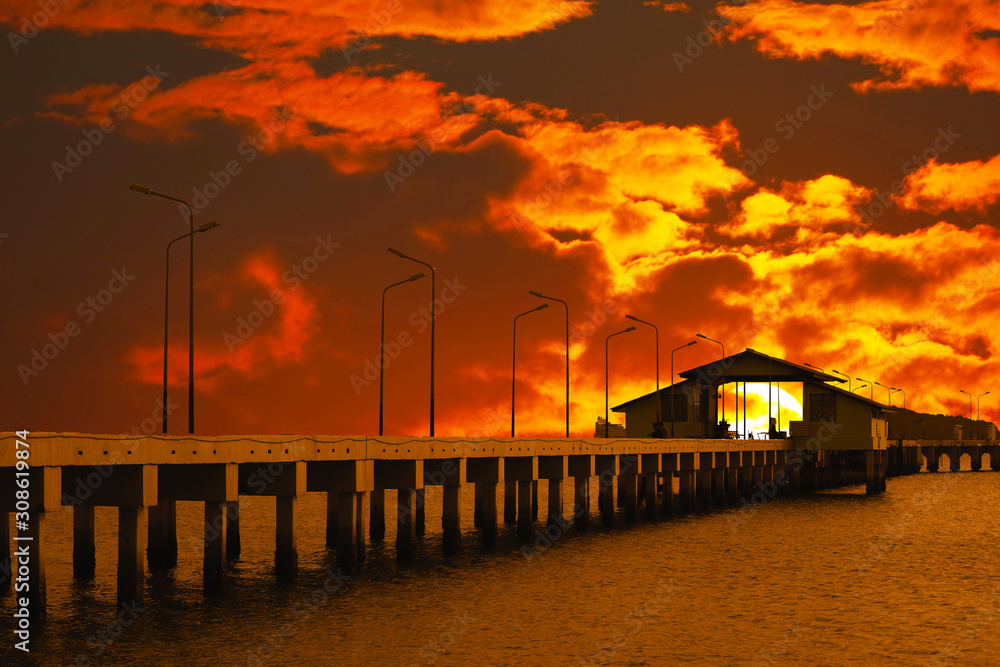 sunset sky red cloud on pavilion on pier and silhouette light poles