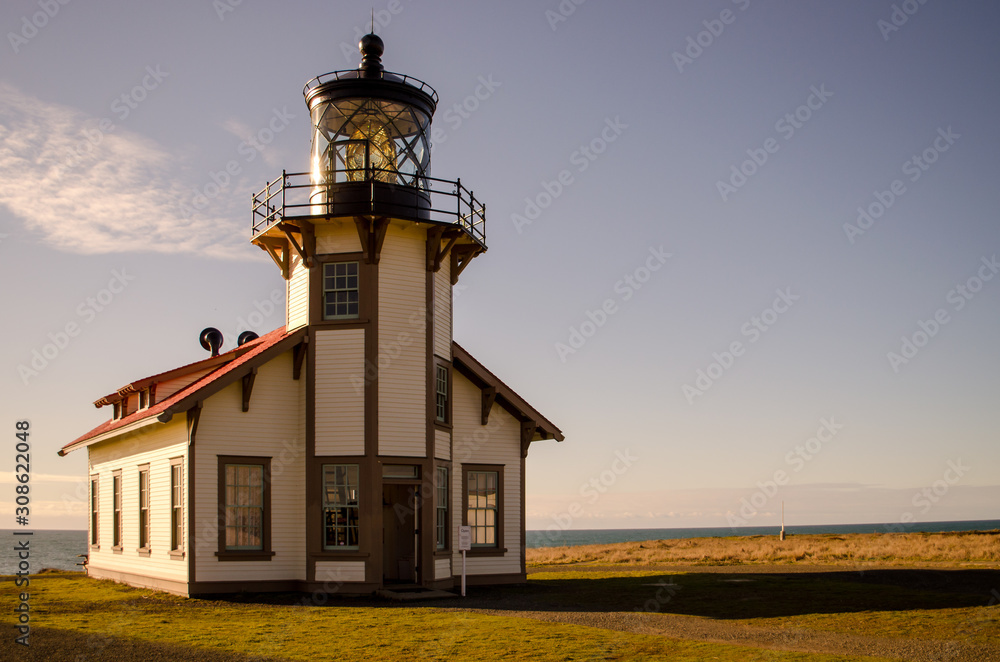 Point arena lighthouse california at sunset .