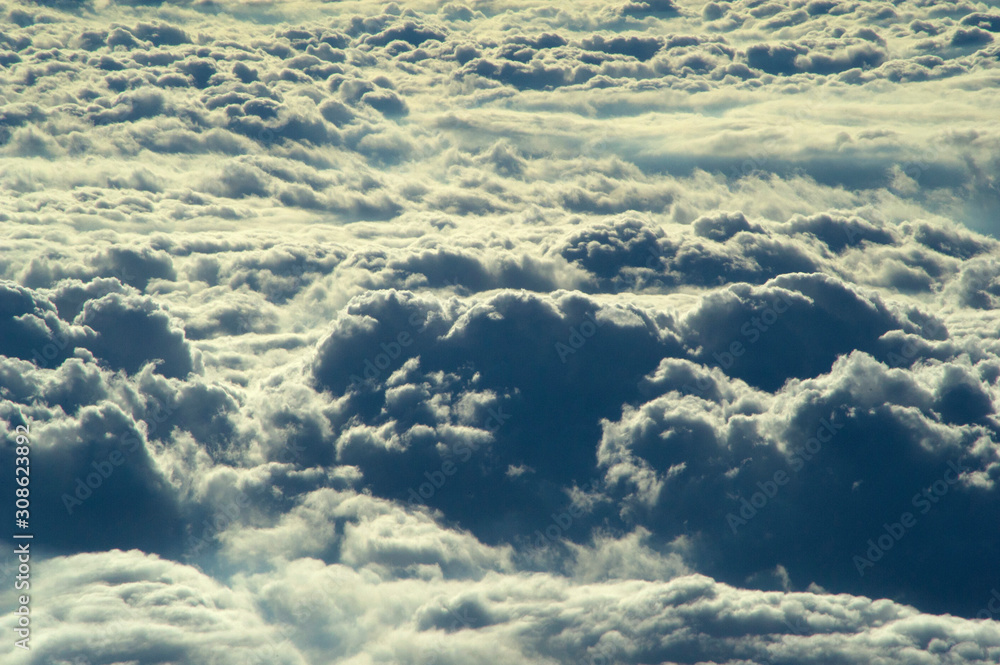 Naklejka premium View of clouds in the sky from an airplane window