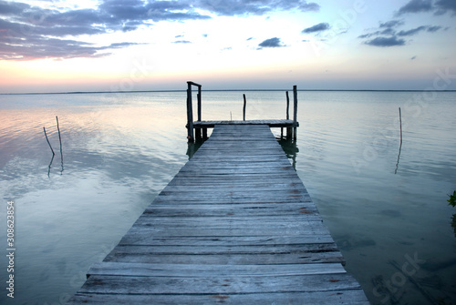 Small wooden pier on a lagoon in Sian Ka'an biosphere reserve, Mexico photo