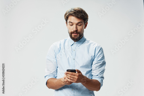 young man texting on his mobile phone