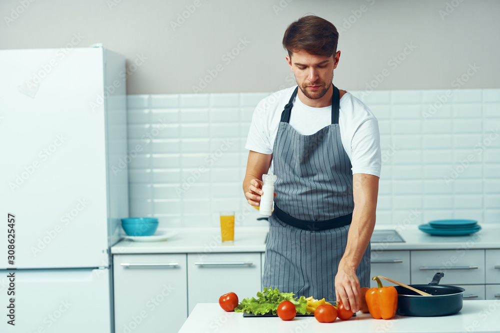 woman cutting vegetables in kitchen woman cutting vegetables in kitchen