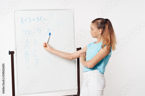 woman writing on a board