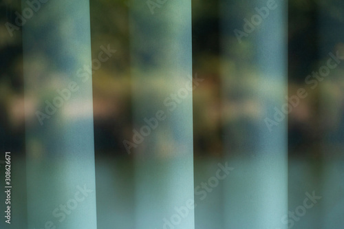 grey green nature strip reflection on fabric curtain abstract background