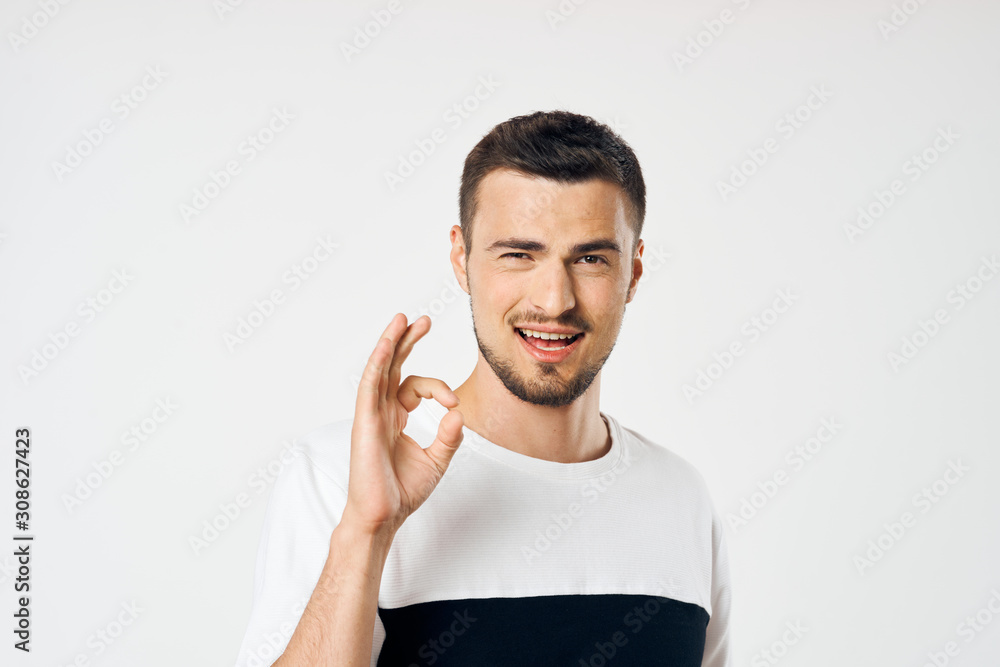 portrait of young man looking at camera portrait of young man looking at camera
