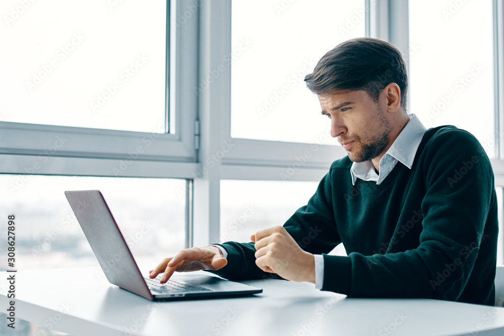 businessman working on laptop in office businessman working on laptop in office