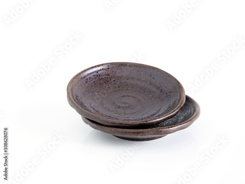  Empty brown ceramic plate stacked isolated on white background. 