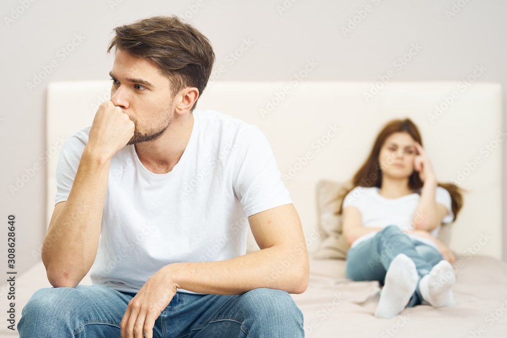 couple sitting on sofa and watching tv couple sitting on sofa and watching tv