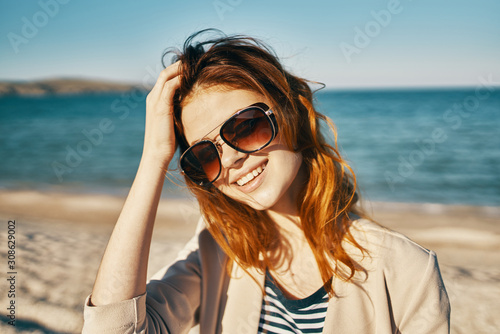 woman with sunglasses on beach