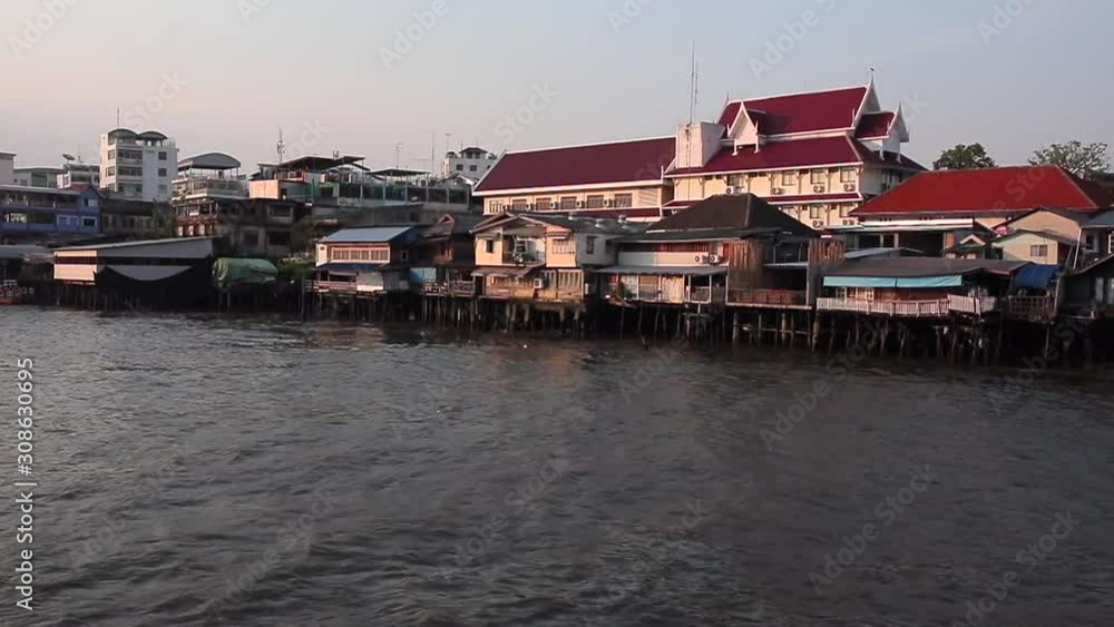 Chao Phra River in Bangkok. View from the boat to the slums of Bangkok, standing by the Chao Phrai River Chao Phra River in Bangkok. View from the boat to the slums of Bangkok, standing by the Chao Phrai River