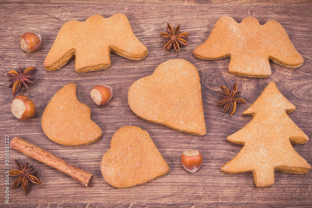 Fresh baked gingerbreads and spices for baking, christmas time concept Fresh baked gingerbreads and spices for baking, christmas time concept