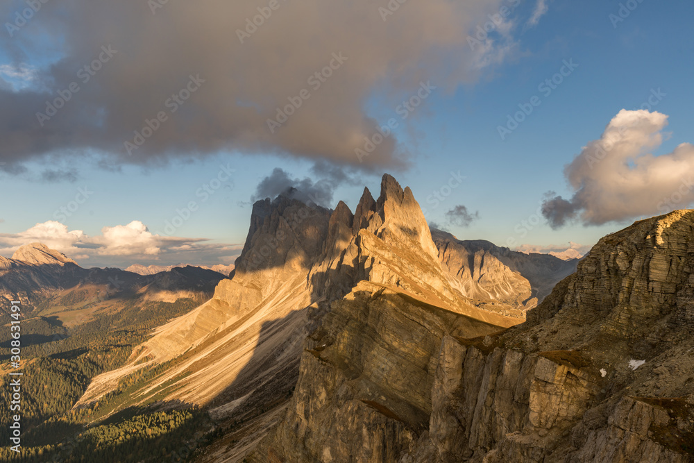 Sunset landscapes in Seceda with clouds and blue sky in Dolomites, South Tyrol, Italy