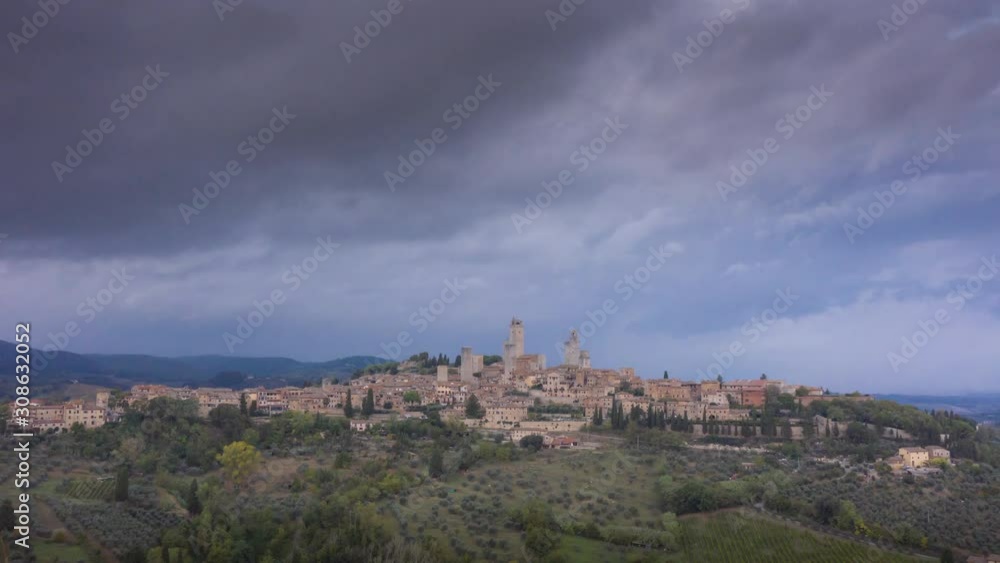 Aerial view of San Gimignano and its medieval old town with the famous towers, time lapse Aerial view of San Gimignano and its medieval old town with the famous towers, time lapse