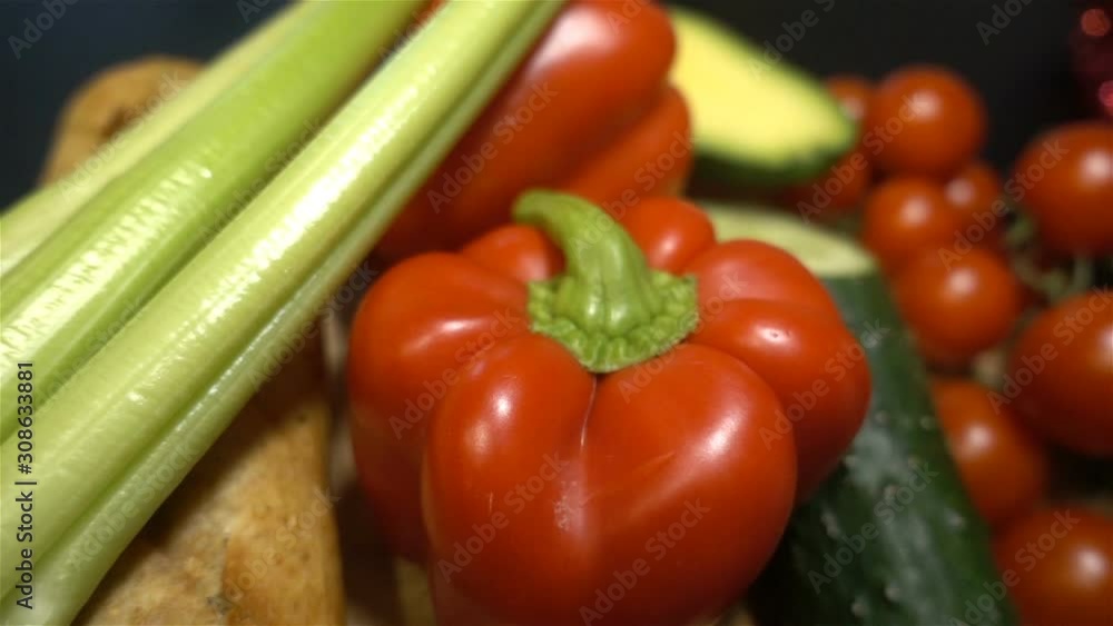 Fresh vegetables lie on a wooden table close. hd Fresh vegetables lie on a wooden table close. hd