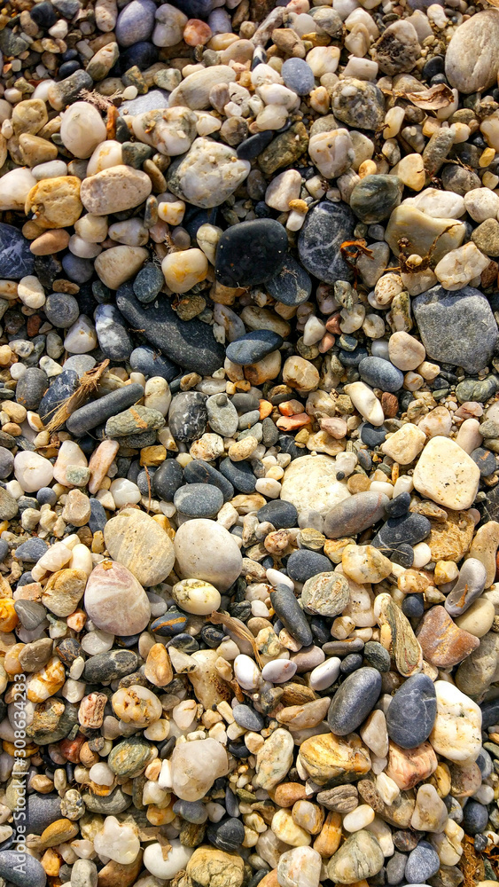 the texture of gravel with beautiful colors. ground pebble background. Beautiful background texture with sea pebbles. the texture of gravel with beautiful colors. ground pebble background. Beautiful background texture with sea pebbles.